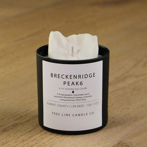  A white soy wax replica candle of  Breckenridge Peak 6 in a round, black glass.