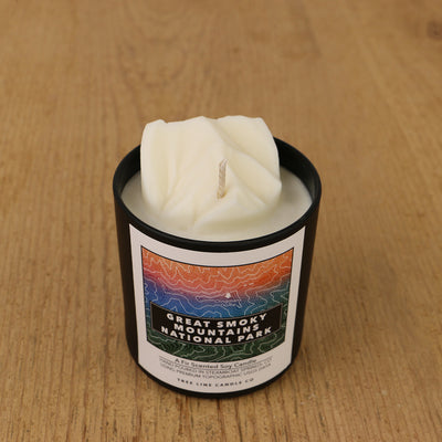  A white soy wax replica candle of Clingmans Dome in a round, black glass.