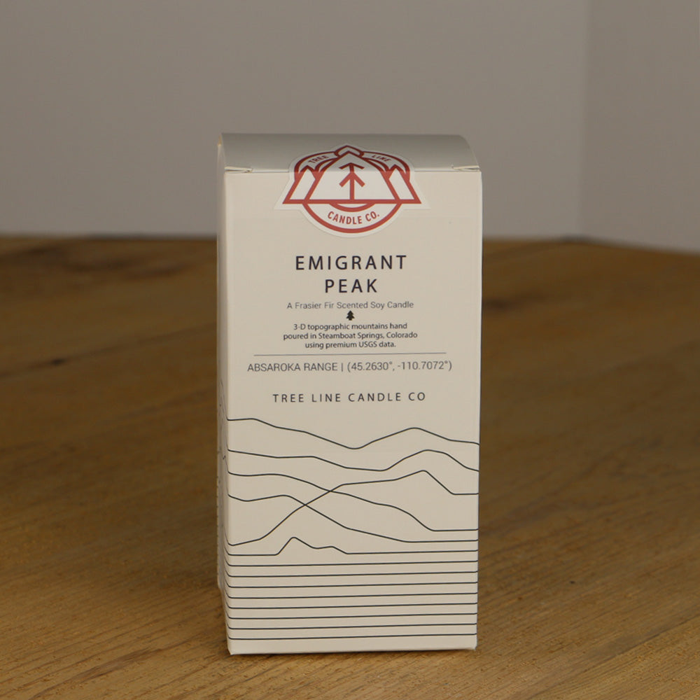 A white box with black lettering and a red and white Tree Line Candle Co.  logo.