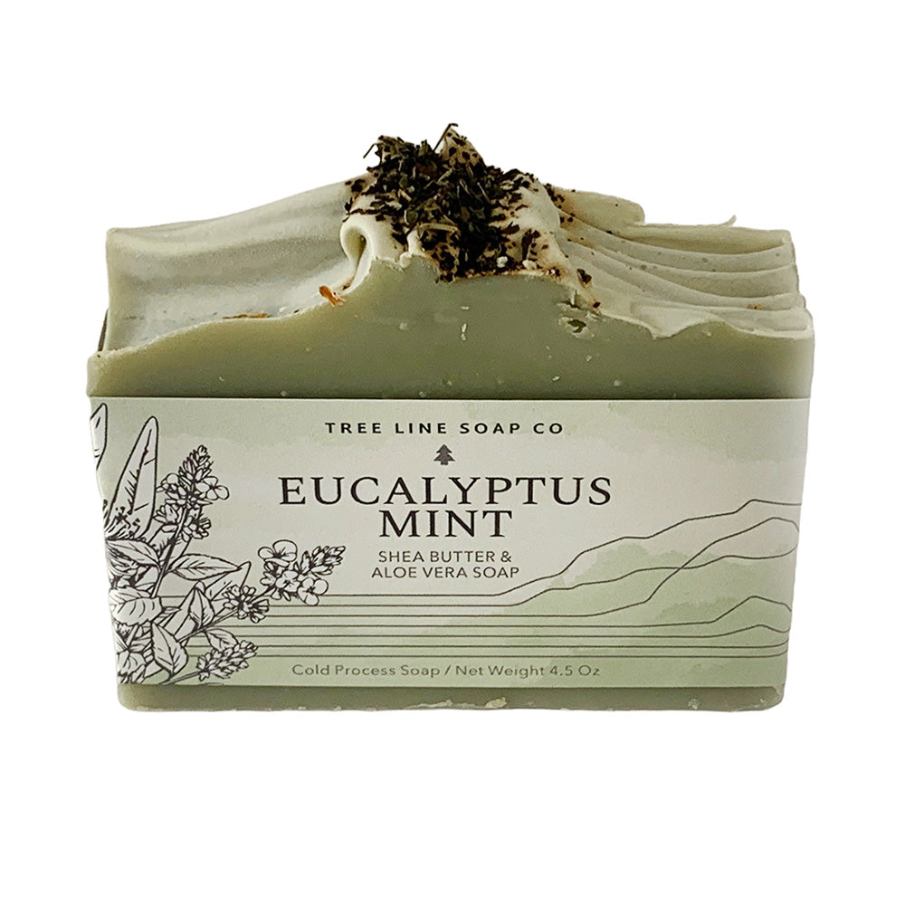 A single bar of Eucalyptus Mint soap is wrapped in a white and green label.