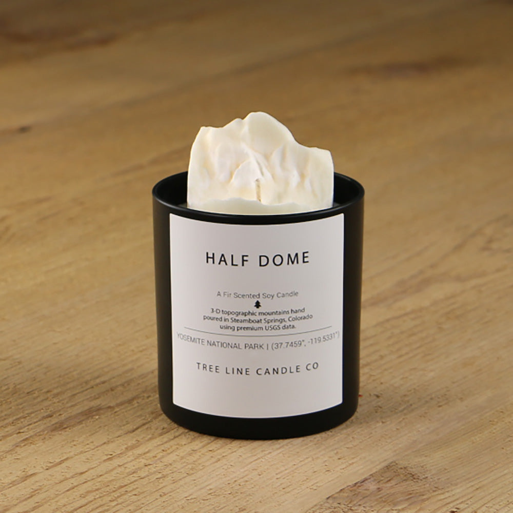  A white soy wax replica candle of Half Dome summit in a round, black glass.