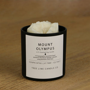  A white soy wax replica candle of Mount Olympus in a round, black glass.