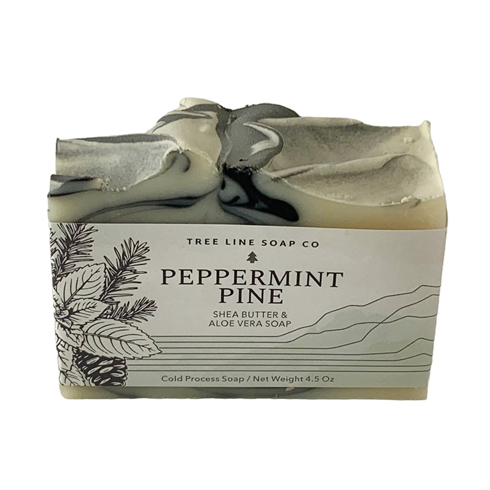 A single bar of Peppermint Pine soap is wrapped in a green and white label.